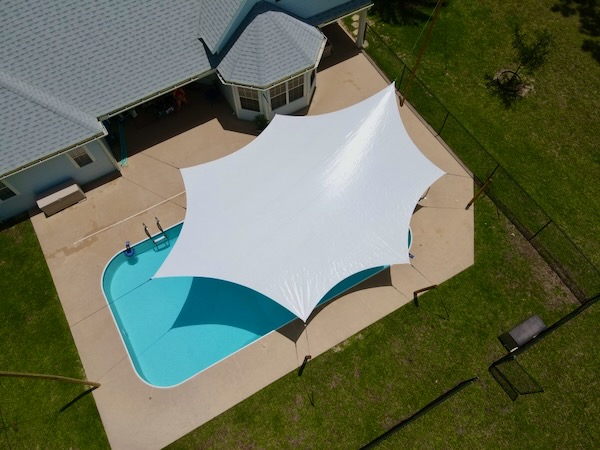 bird's view of rainshade and its shadow in a pool by tim elverston at windfire designs