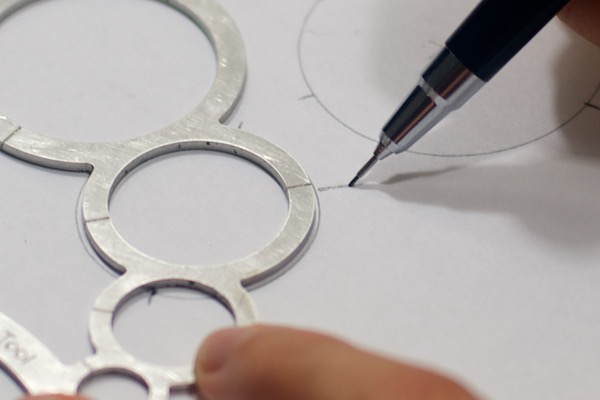 WindFire Designs Circle Tool showing marking at the halfs to find the center of the circle with an x
