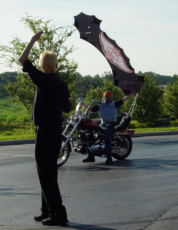 Quadline Harley Davidson kite made by WindFire Designs flying over a Harley Davidson bike