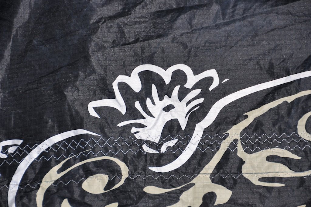 Repaired kite with graphics lined up cleanly on the front side