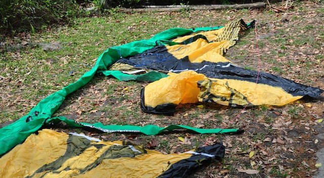 Naish kite with struts separated from the canopy, mid-repair