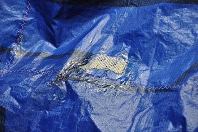 Kitefix urethane adhesive repair system in use on kite fabric