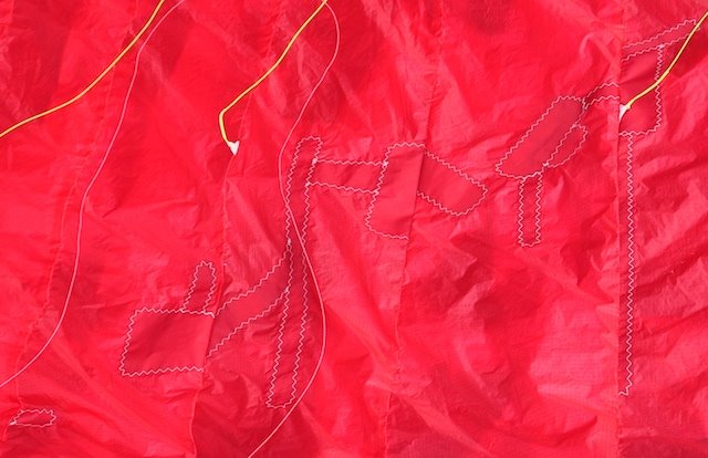 Mac Para Eden 3 paraglider cell damage prior to repair, with alignment tape